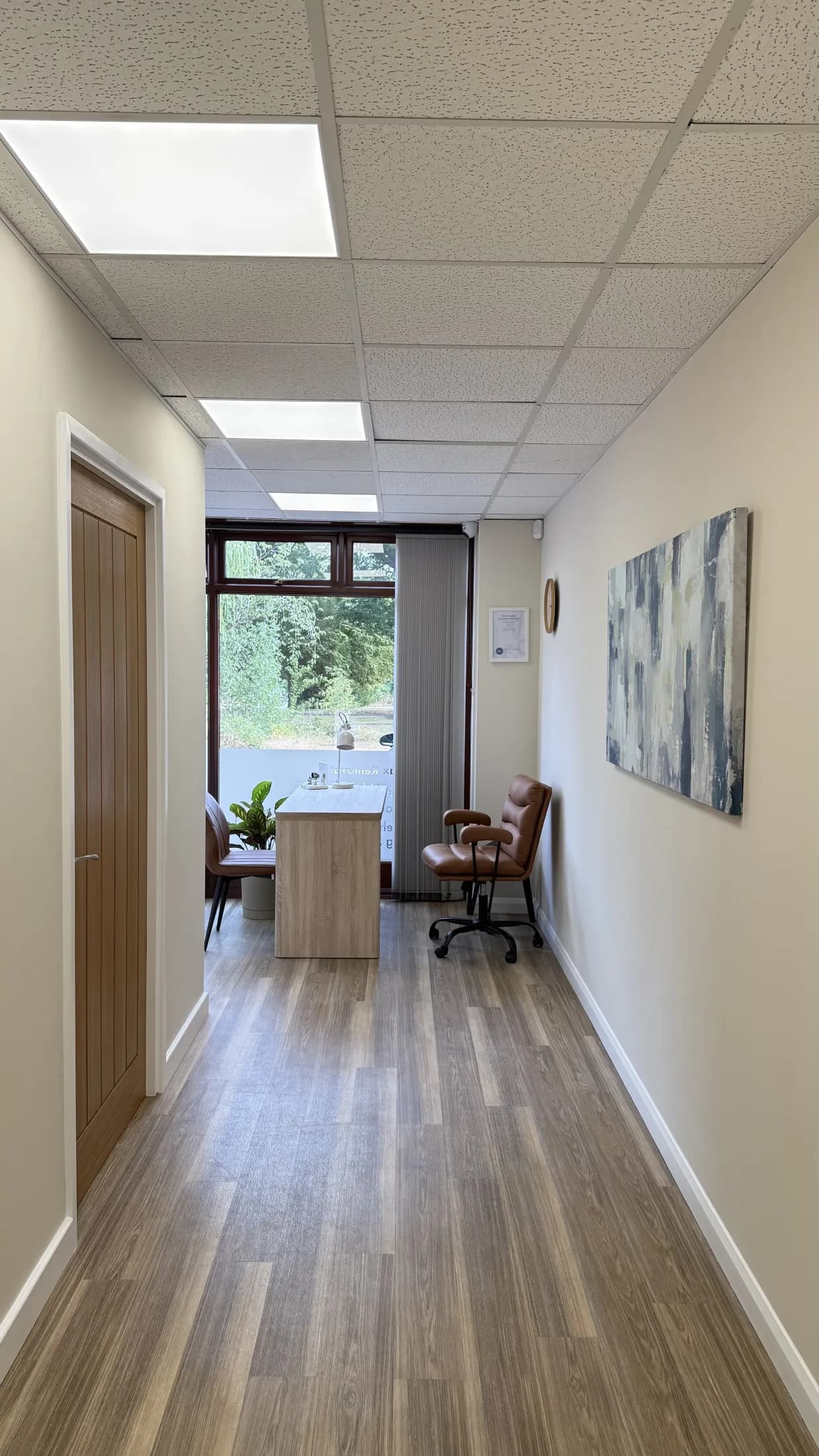 The corridor inside Tide Hearing's Thorpe End clinic, overlooking The Green